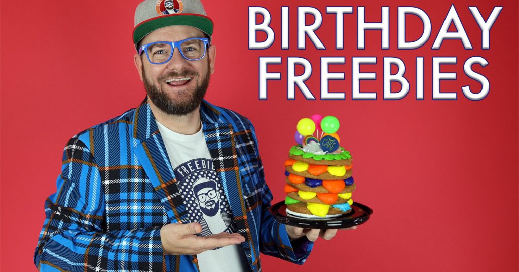 the freebie guy holding a birthday cake to celebrate birthday freebies