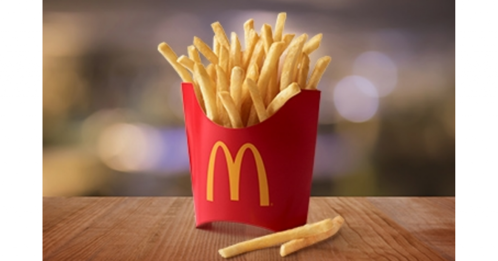 large box of mcdonald's fries standing up on a table