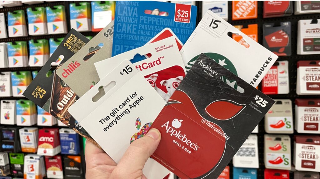 hand holding multiple gift cards