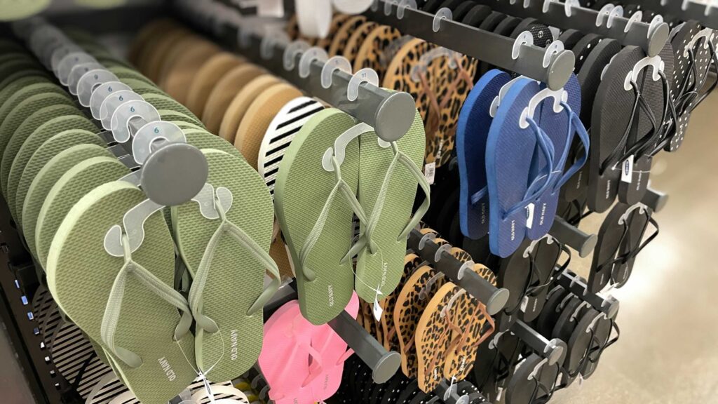 OLD NAVY SHOES flip flops hanging on pegs in store
