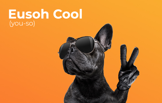 dog wearing sunglasses and giving the peace symbol with two fingers up