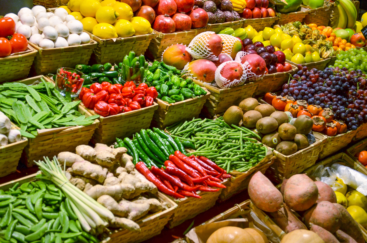 fresh vegetables in baskets at a store