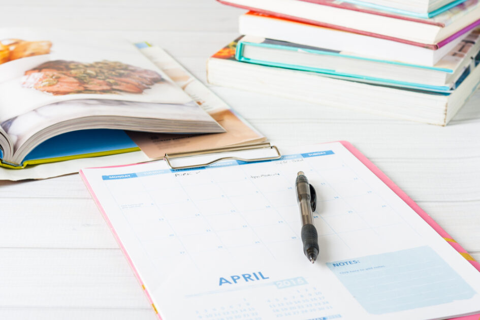 meal planning book on a table with a pen