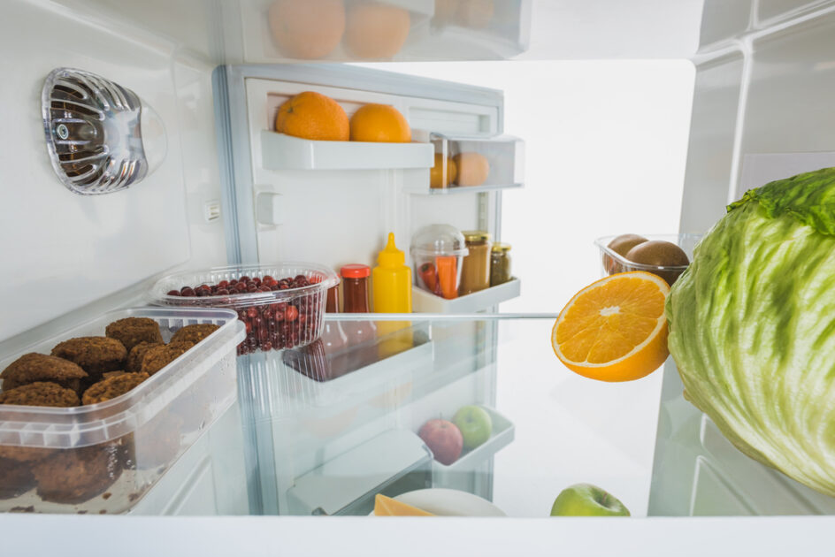 inside of a refrigerator with fresh fruit and produce