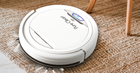 white robot vacuum on floor