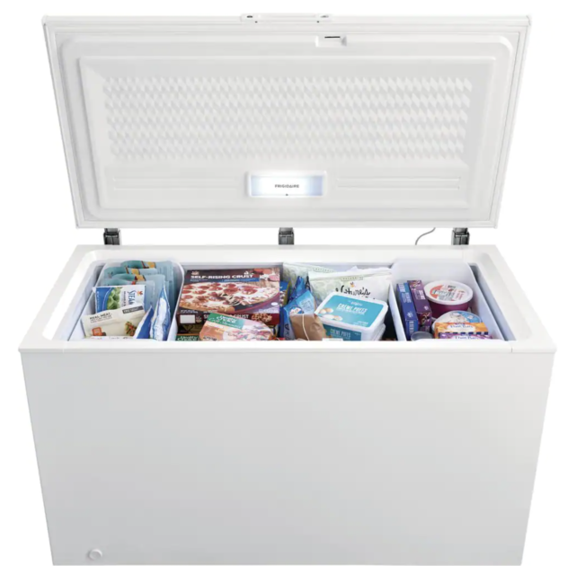 chest freezer with the lid open and food inside