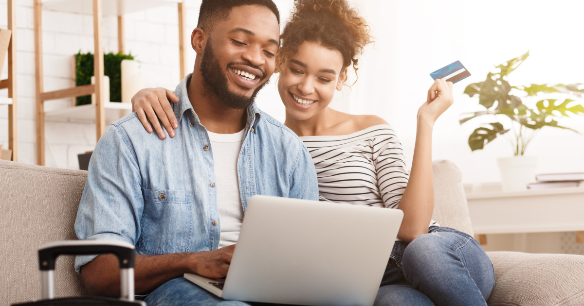 couple on couch with credit card