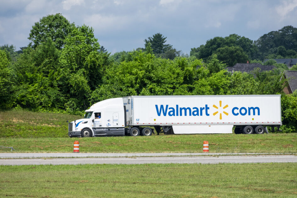 walmart truck on road with green trees