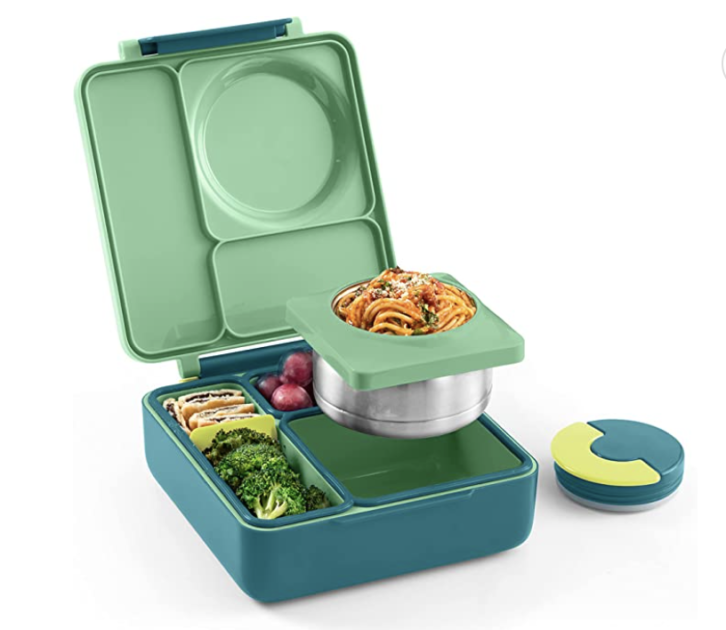 bento box with food and small containers in it