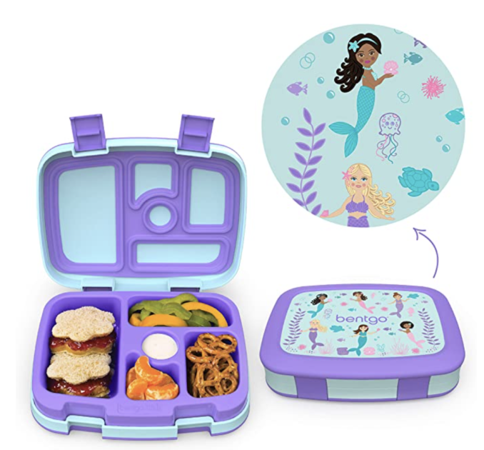 Bento lunchbox open with food in it and another one next to it