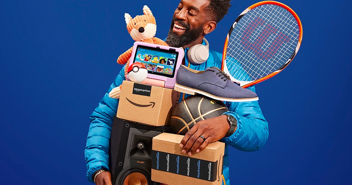 man holding Amazon boxes, a shoe, basketball, tennis racket, stuffed animal, tablet, and a Pokemon ball - See the benefits of a free prime trial