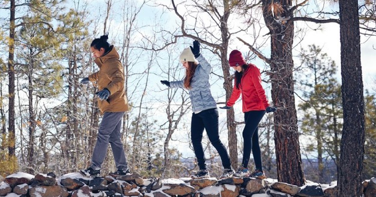 columbia three people walking in the woods