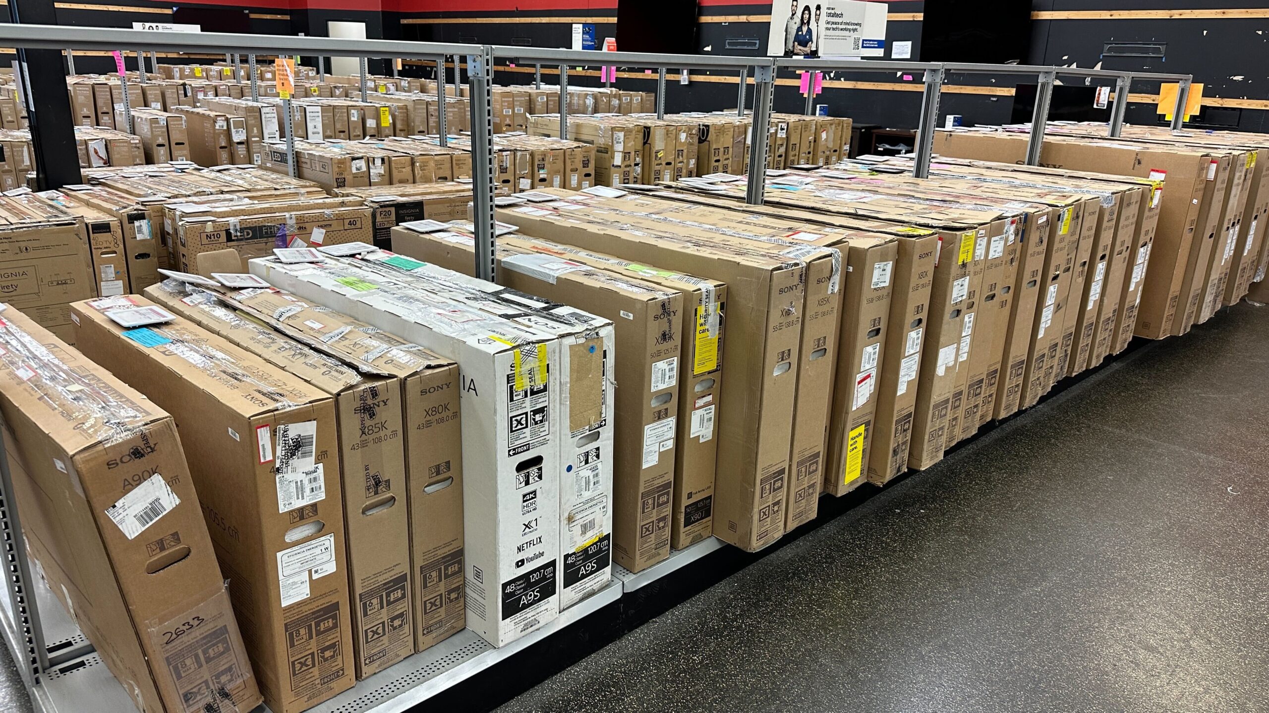 Best Buy outlet - rows of tv's - The Freebie Guy
