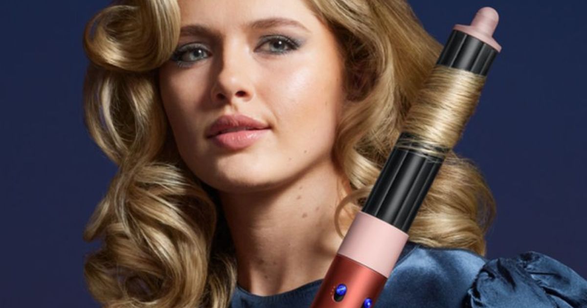 woman using a Dyson Air Wrap