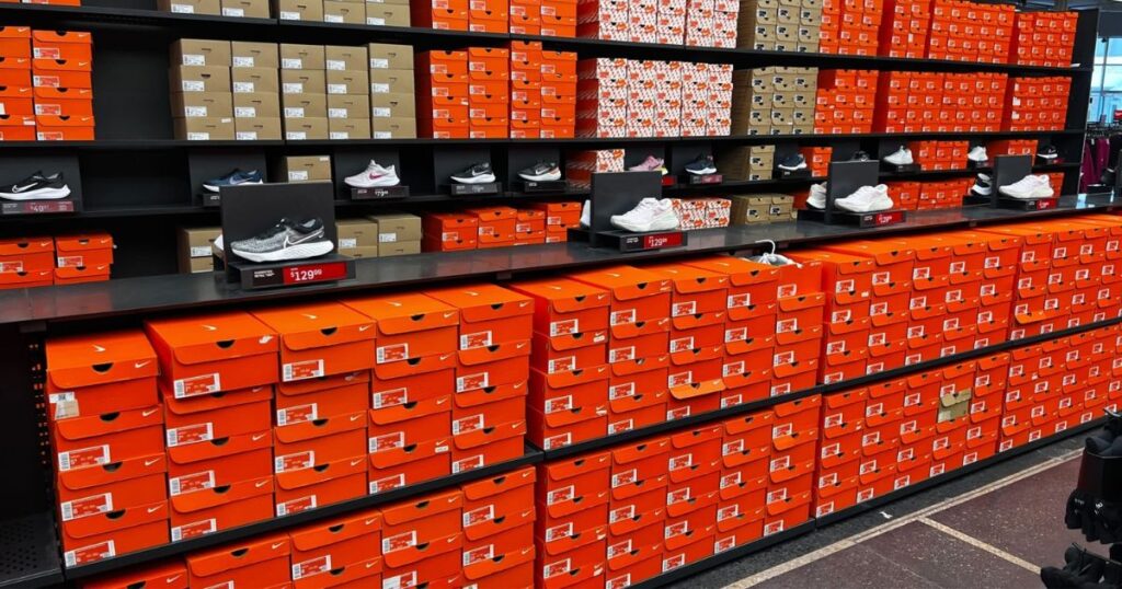 Dick's Sporting Goods Nike Wall display of Adidas & Nike Shoes & Orange Nike Shoe Boxes at Dick's Sporting Goods During Shoe Clearance Promotion
