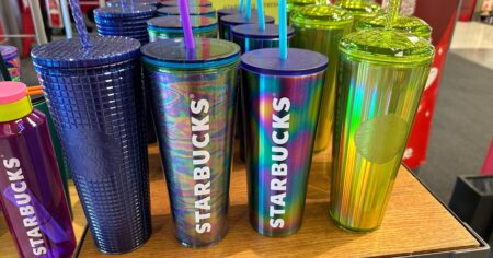 row of Starbucks cups
