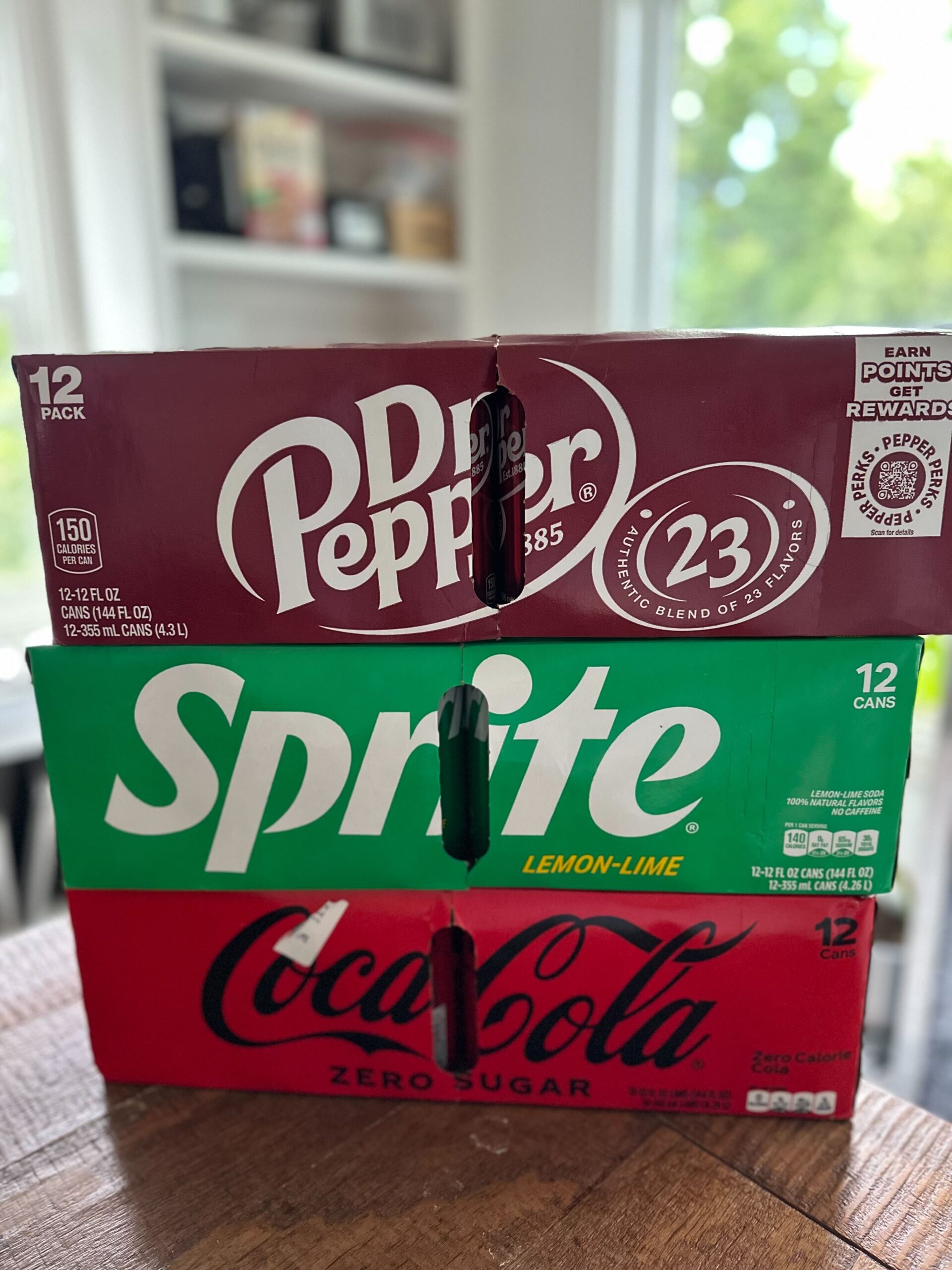 case of Dr. Pepper on a case of Sprite that is on a case of Coke