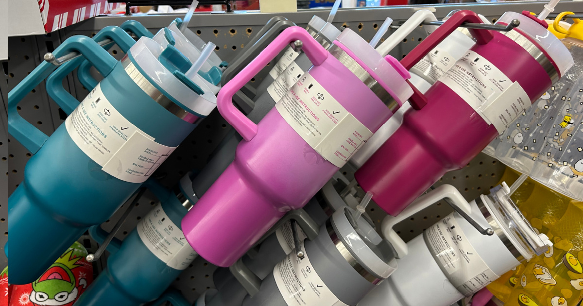 tumblers hanging on hooks at a store