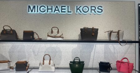 Michael Kors bags on shelves