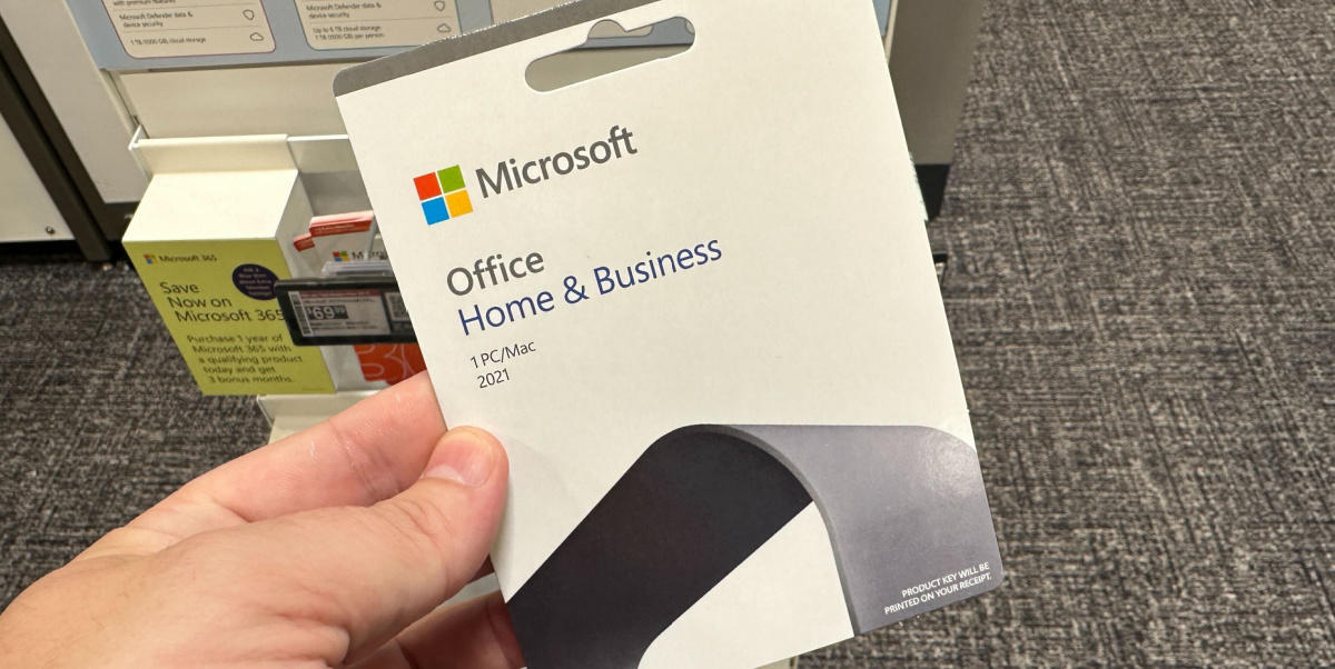 hand holding a Microsoft Home & Business card