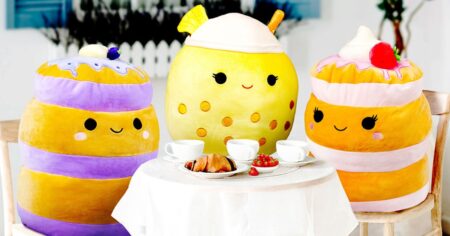 three Squishmallows at a table