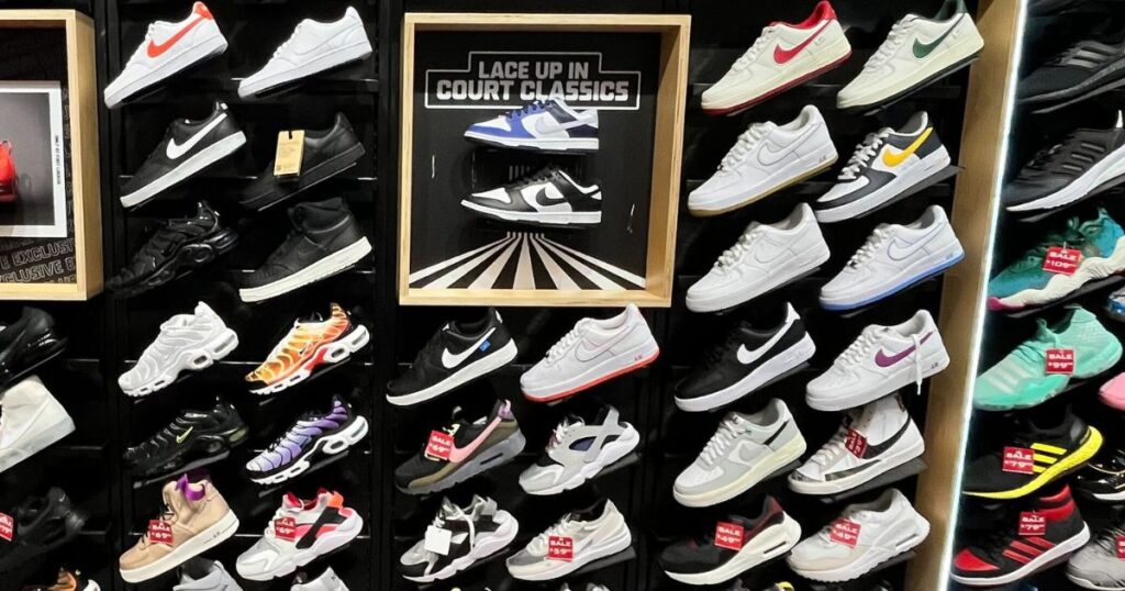 popular nike shoes on display on store wall