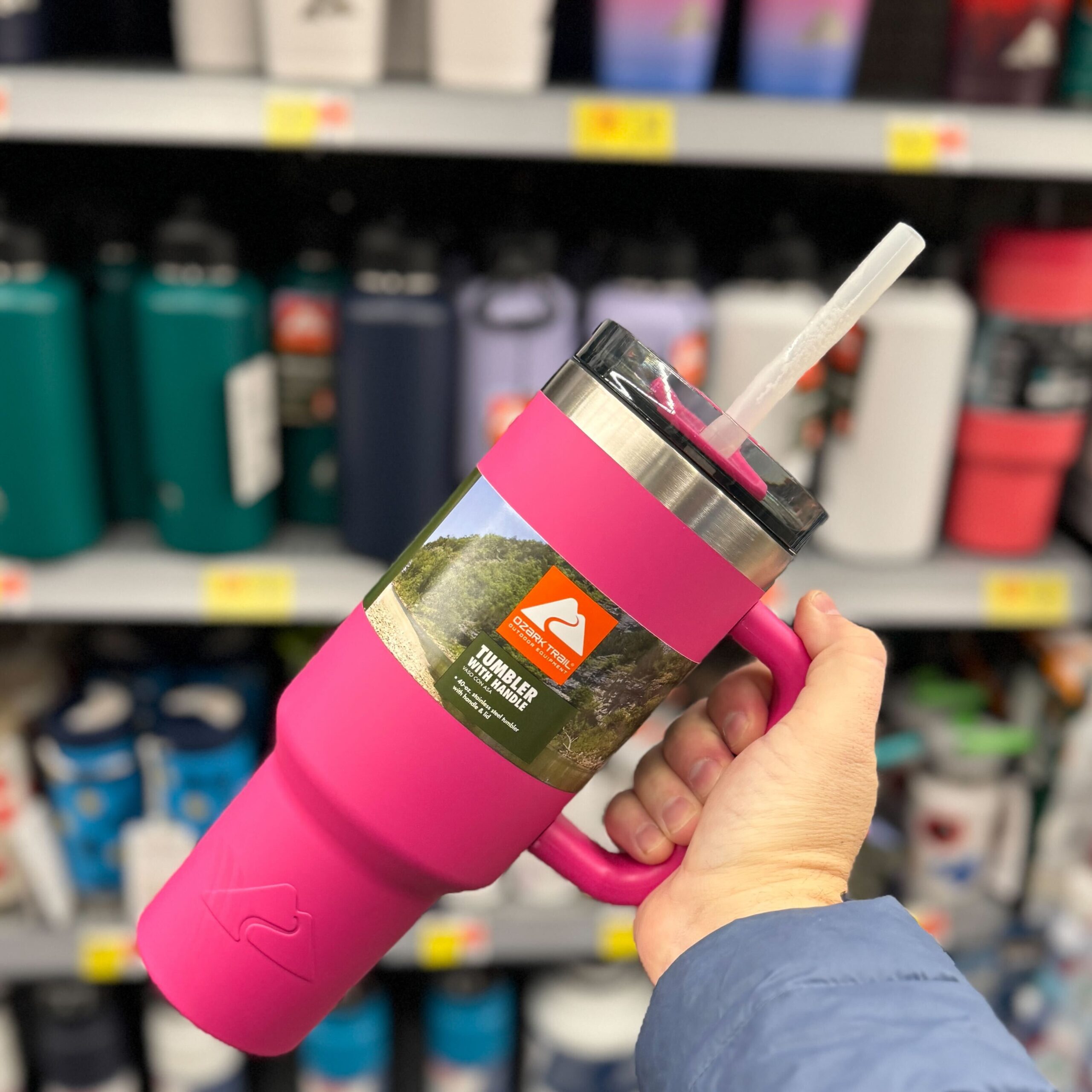 hand holding an Ozark Trail tumbler