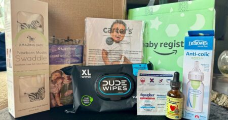baby swaddle, pack of Dude Wipes, Amazon baby registry bag, baby vitamins, and Carter's onesie