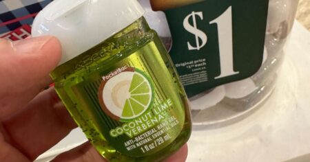 hand holding a Bath & Body Works hand sanitizer