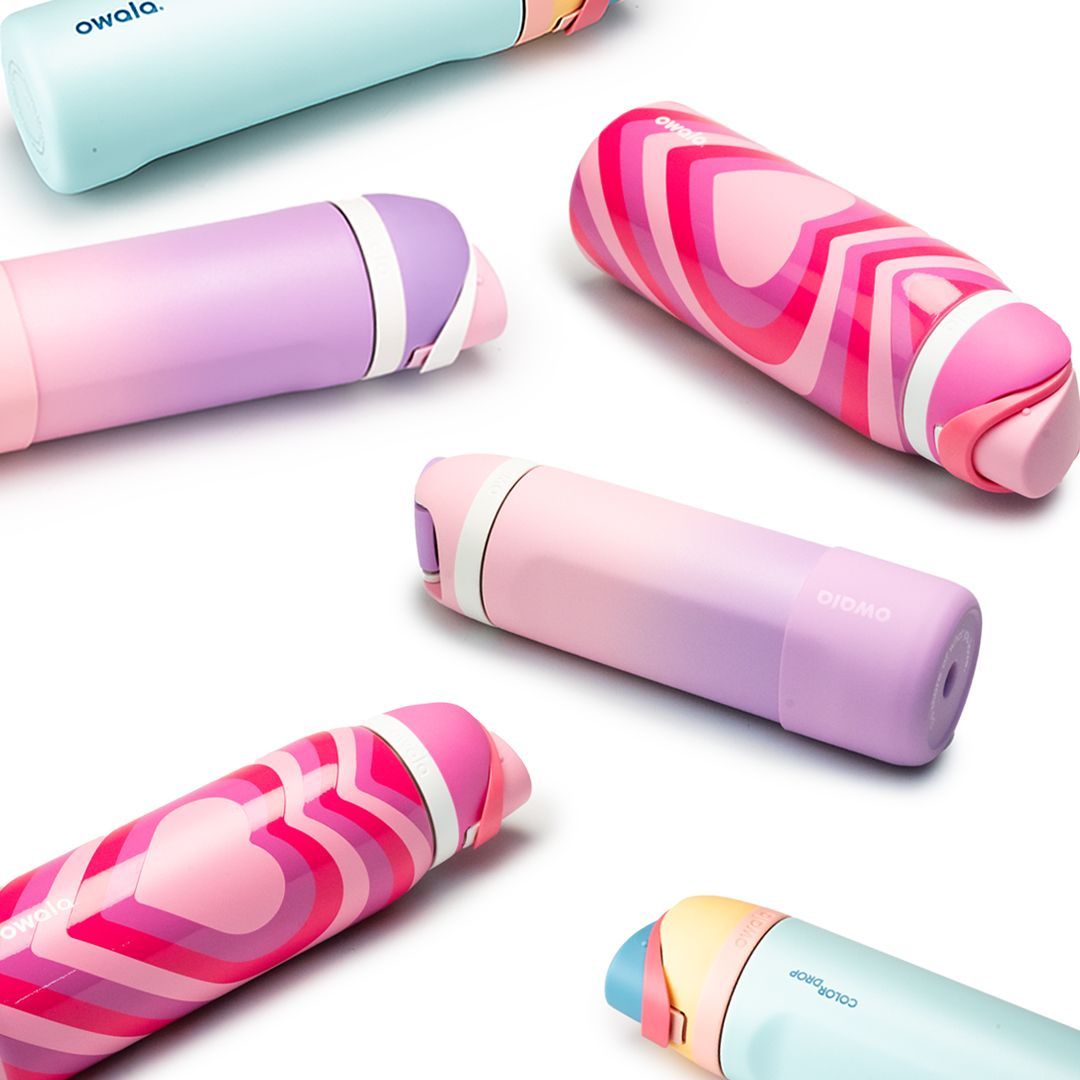 various Owala FreeSip Bottles laid on counter