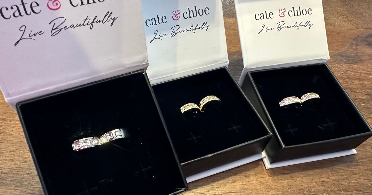 Three pairs of earrings in boxes