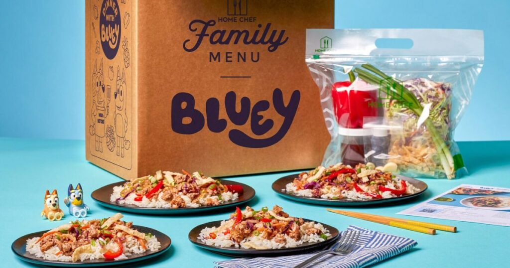 meals on a table with a Home Chef box and Bluey toys
