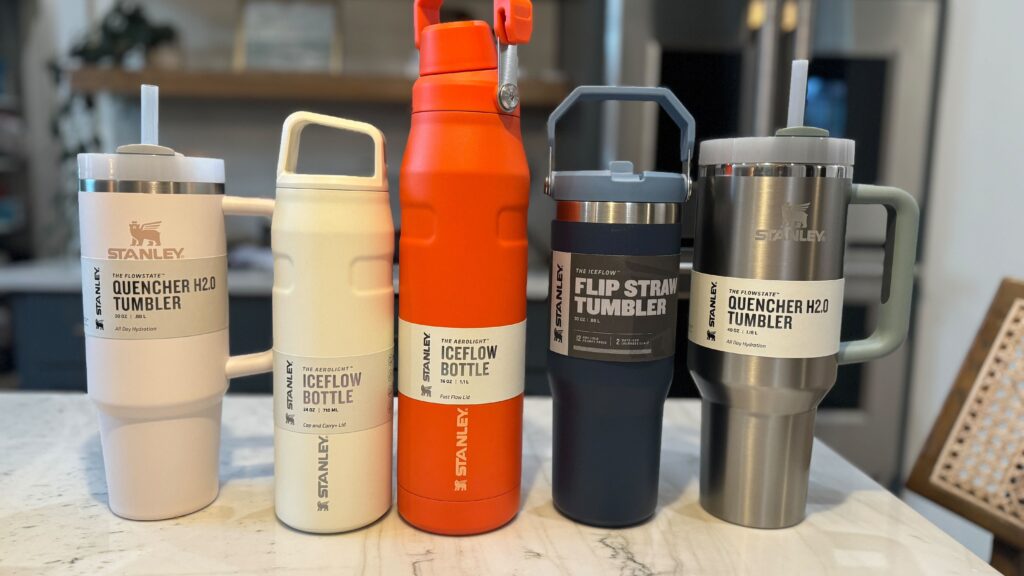 Stanley cups Five different Stanley brand water bottles sitting on a counter including the Stanley Quencher Tumbler