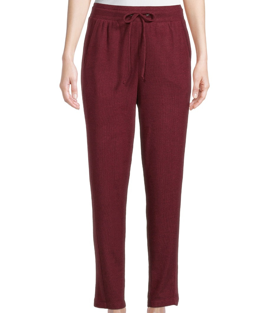 woman wearing maroon joggers and a white tee