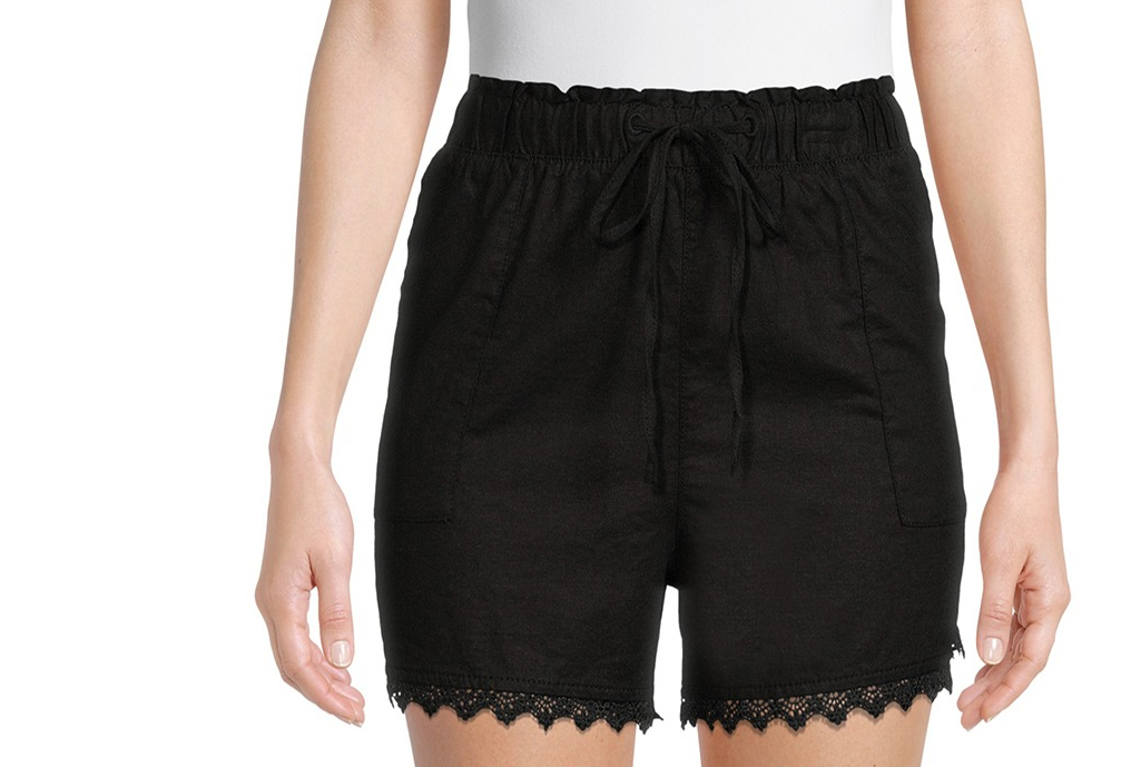 woman wearing black shorts and a white tee