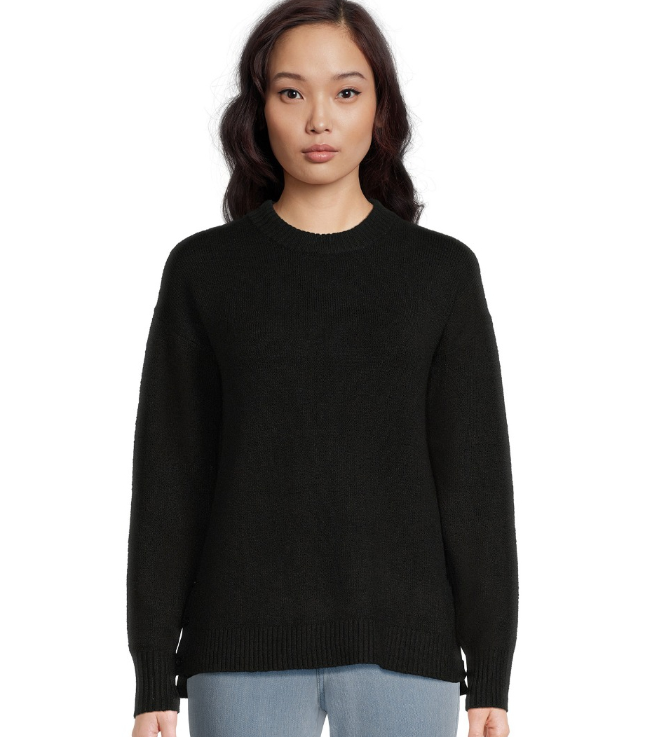 woman in a black sweater and jeans