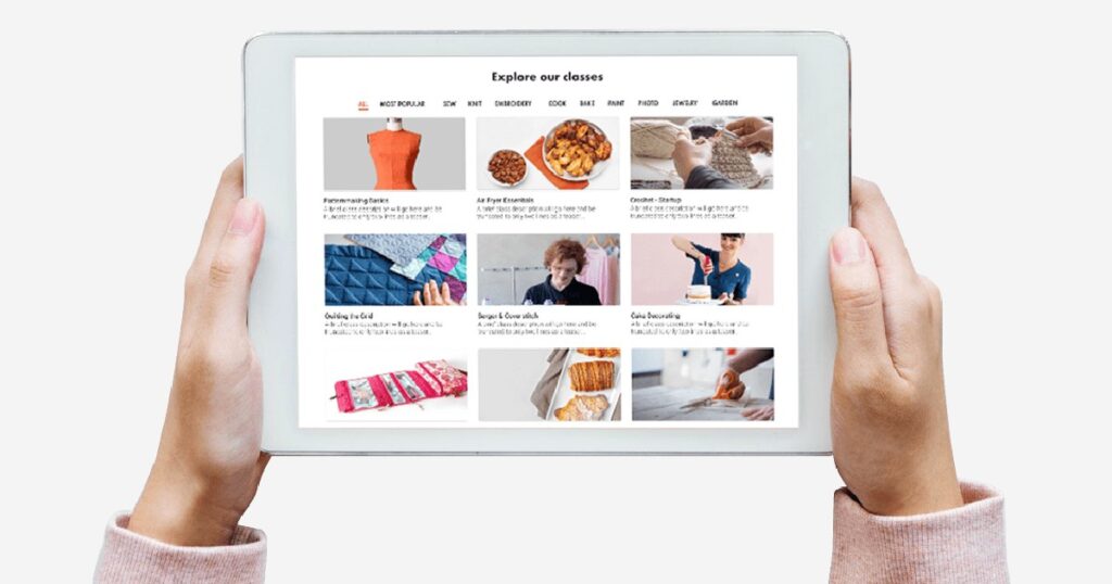hands holding a tablet with Craftsy class options