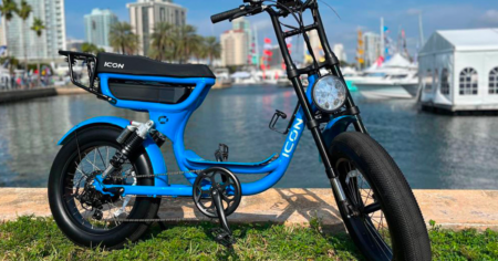 icon e bike in blue in front of water
