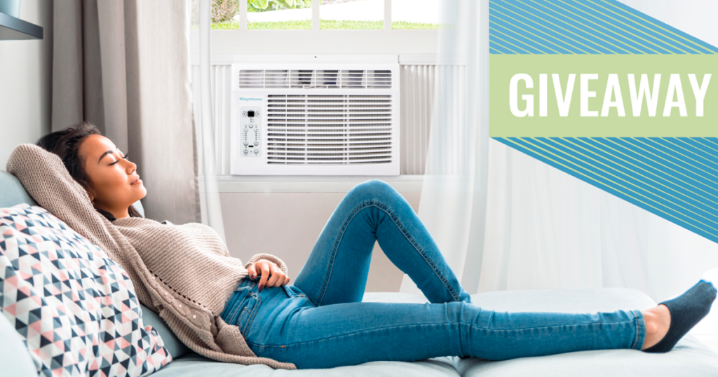 girl laying down next to a window ac unit