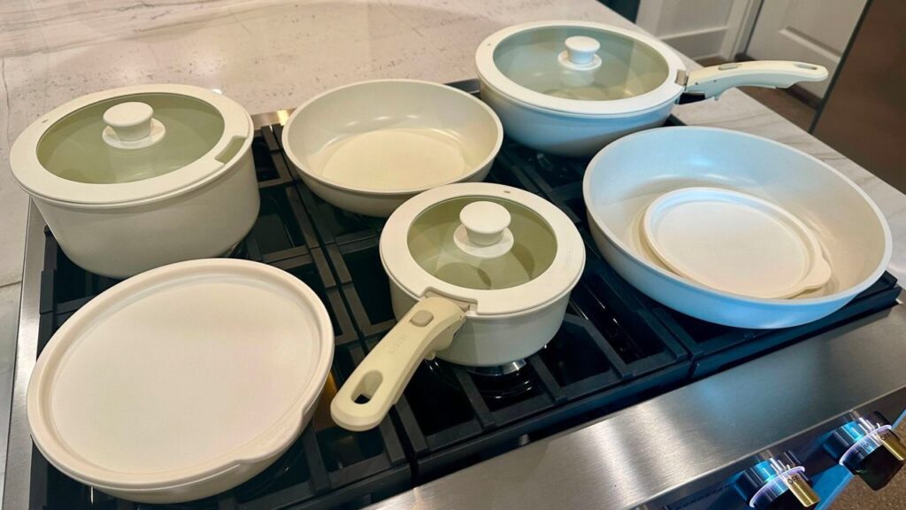 carote-cookware-set-kendall Set of Carote pans and lids on a gas range on display