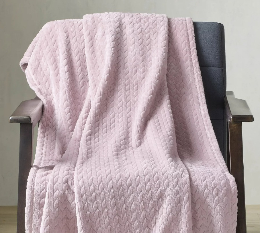 BHG Blanket pink blanket on a chair