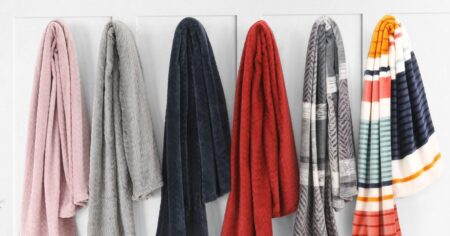row of blankets on hooks