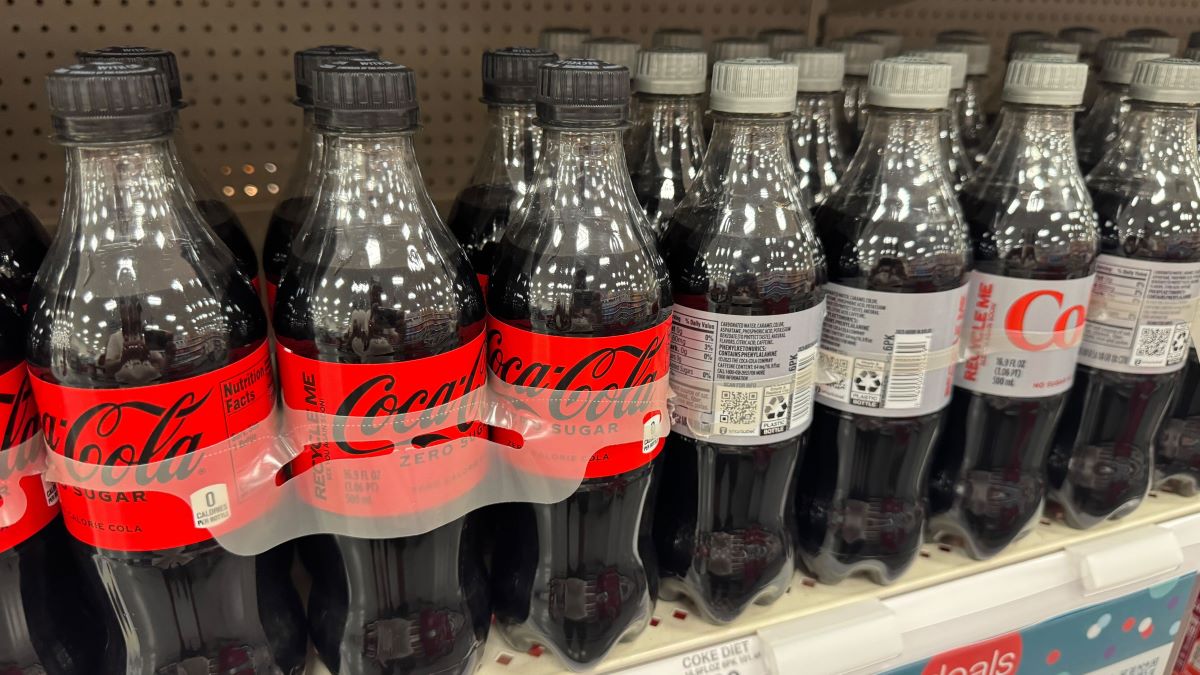 Coke Coca Cola bottles of coke soda on a shelf