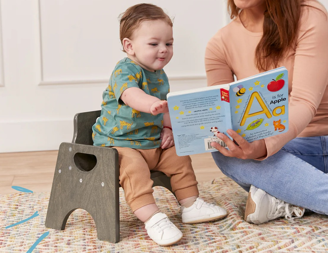 ECR Kids Stackable Wooden Toddler Chair Pack woman reading a book to a toddler sitting in a chair