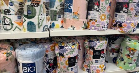 two shelves of throw blankets at Kohl's