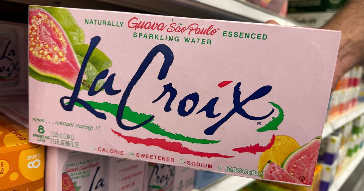 hand holding a case of La Croix Guava Sao Paulo sparkling water
