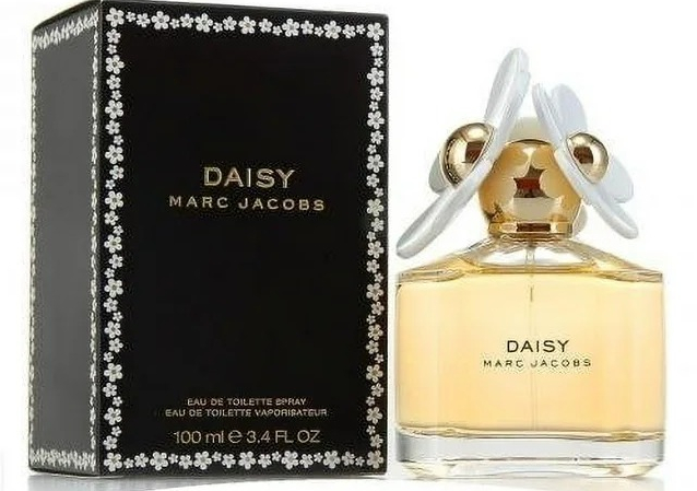 black box with a bottle of perfume next to it