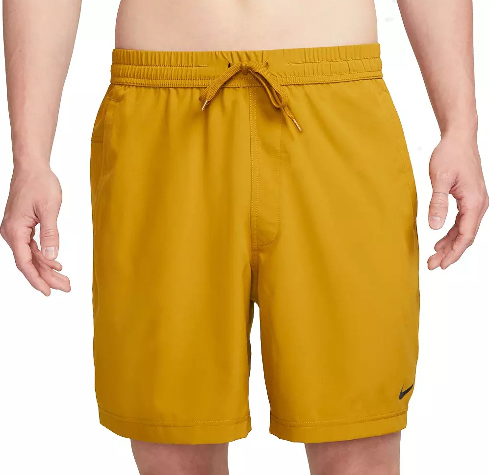 Nike Men s Dri FIT Form Unlined Versatile Shorts man wearing mustard colored shorts