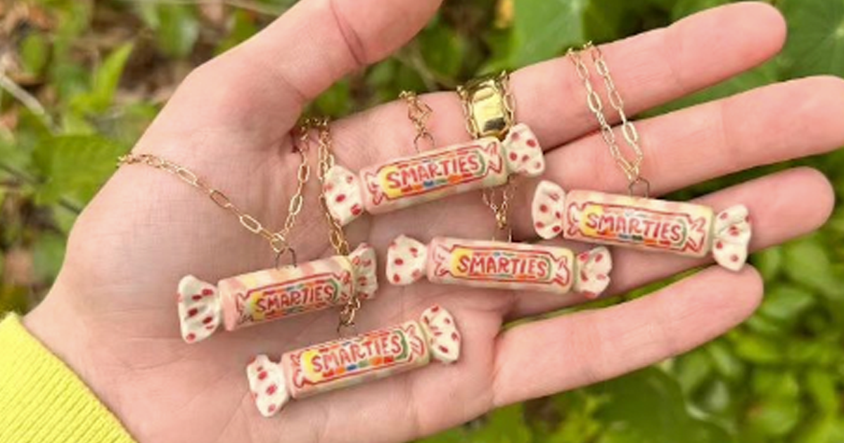 smarties candy necklaces in hand