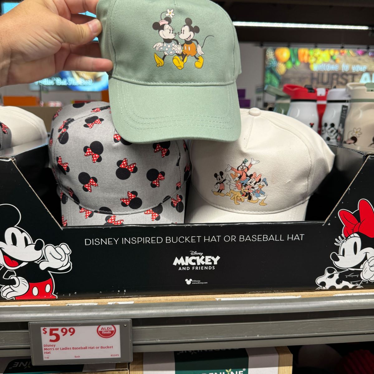 Disney Bucket Hat or Baseball Hat hand holding a hat with Mickey and Minnie Mouse on it